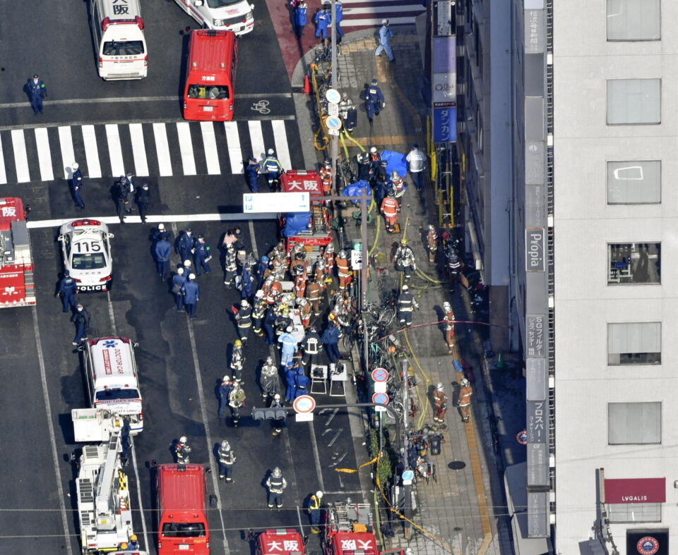 firefighters are seen at a building where a fire broke out in osaka