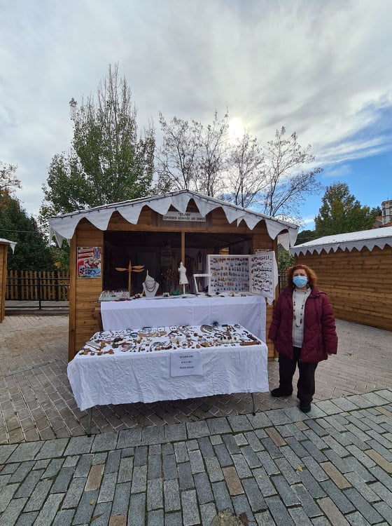 Lygia Mozora next to her Christmas stall