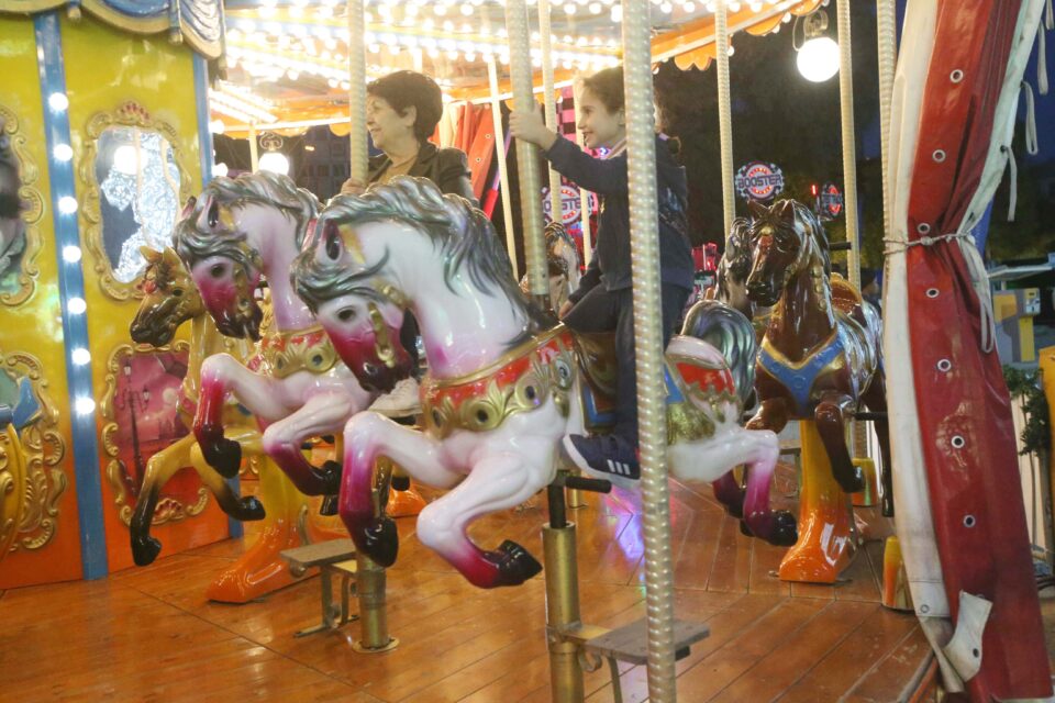 feature nick people enjoy the carousel photos by christos theodorides