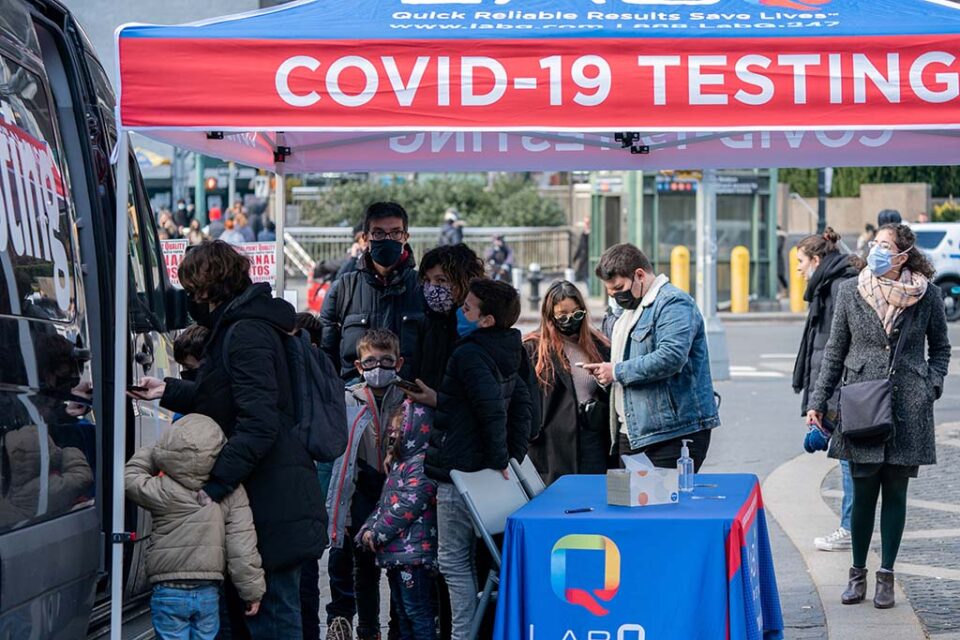 people queue at a popup covid 19 testing site in new york