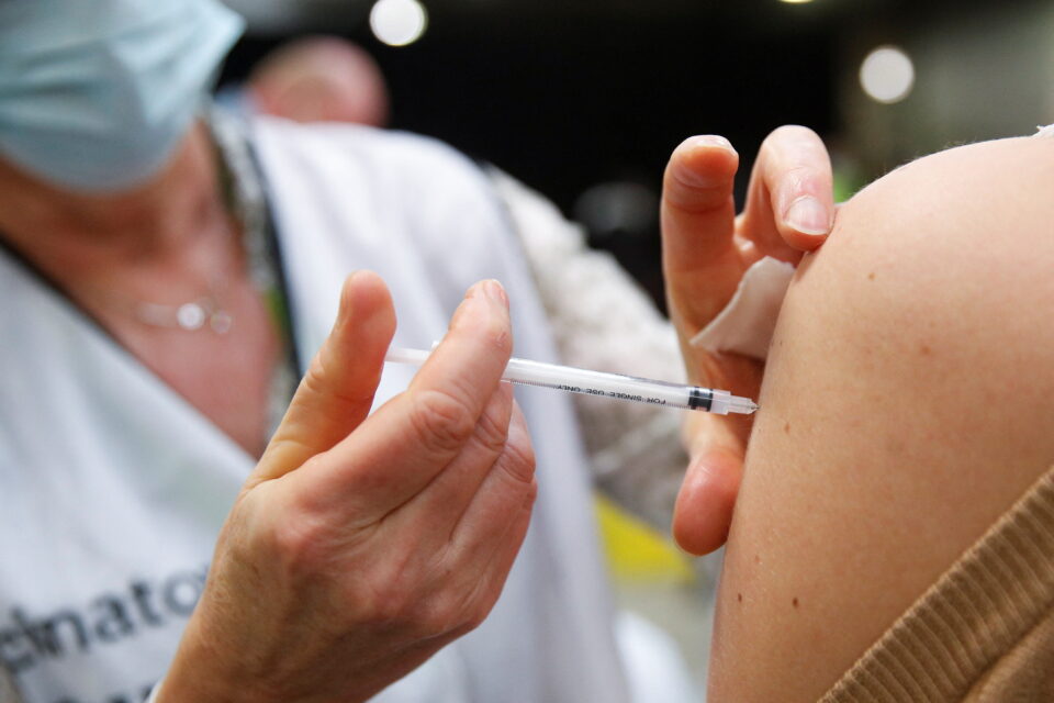people receive booster dose of coronavirus disease (covid 19) vaccine in antwerp