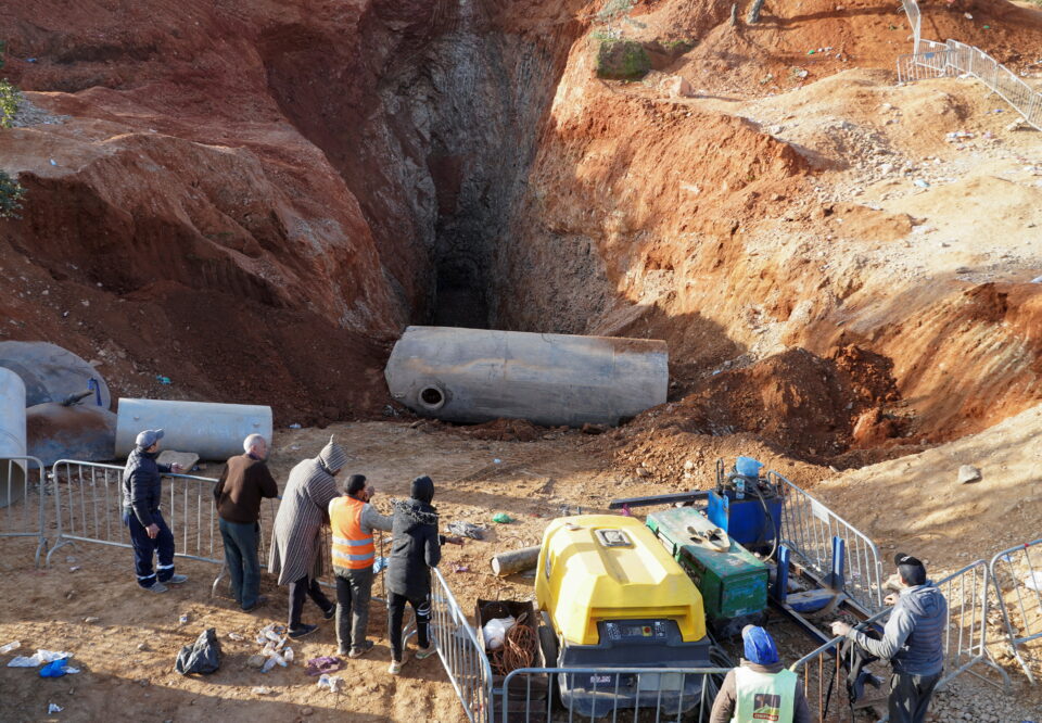 people stand near the site where rescuers retrieved yesterday the body of 5 year old child, rayan awram, near chefchaouen