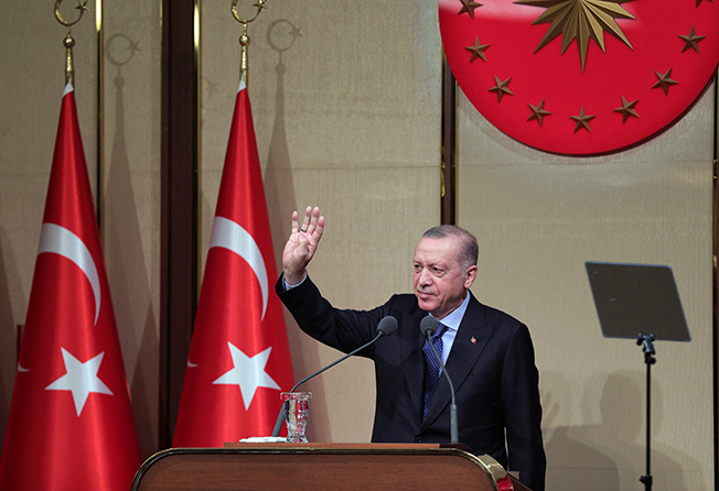 turkish president erdogan greets the audience during a meeting in ankara