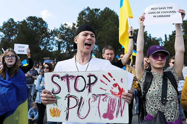 image Waving Ukrainian flags, stop the war protesters rally around world