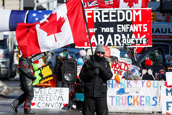 image Trudeau invokes emergency powers to starve protesting truckers of funds
