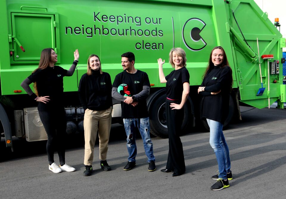 feature paul main cfc members with one of their modern waste management trucks (christos theodorides)