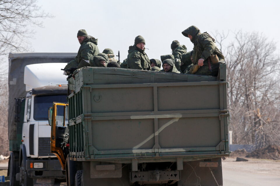 service members of pro russian troops are seen near the besieged city of mariupol