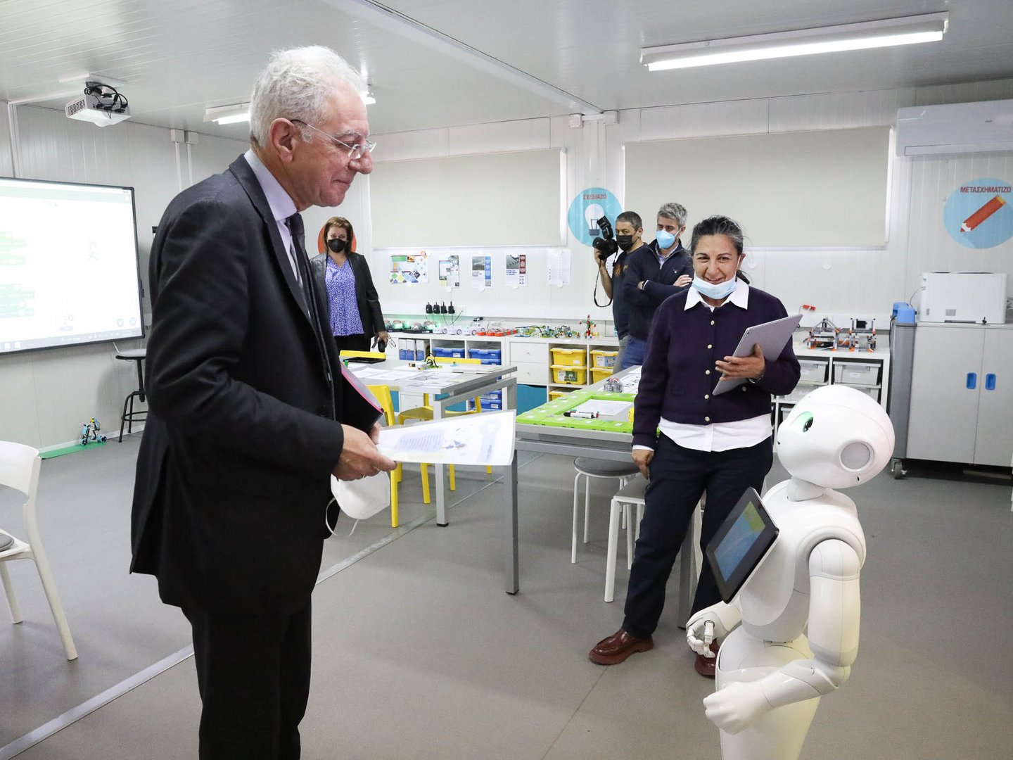 cover Education minister praises tech innovations as he meets robots