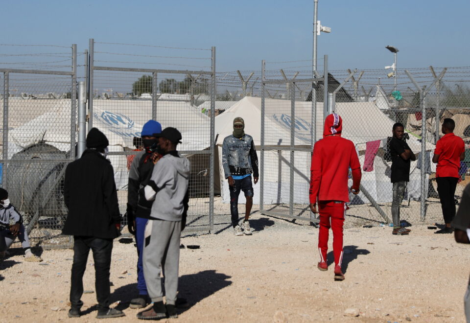 migrants outside the kokkinotrimithia refugee camp on the outskirts of nicosia