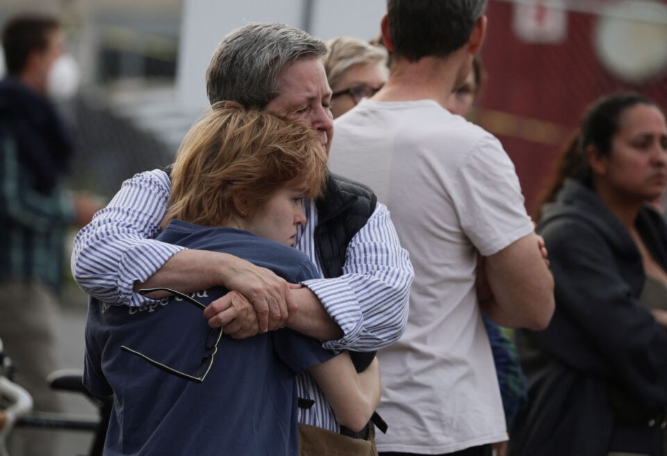 family members wait to be reunited with schoolchildren near scene of reported shooting near the edmund burke school in washington