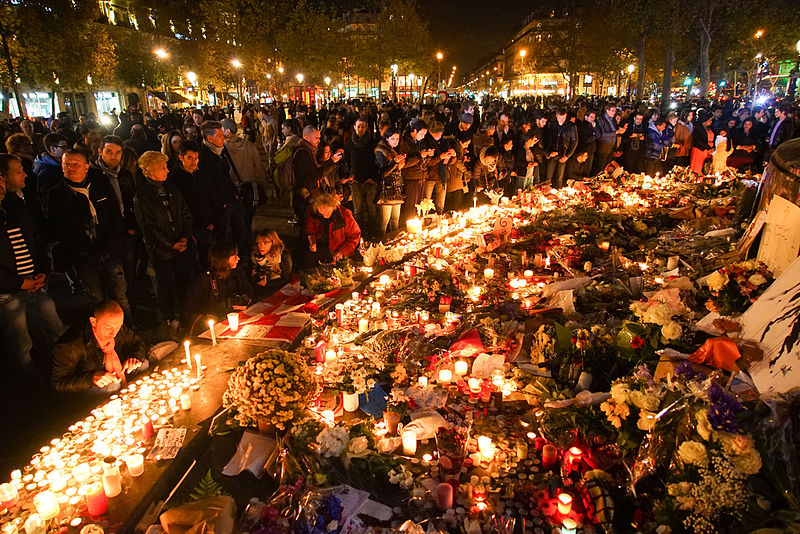 dozens of mourning people captured during civil service in remembrance of november 2015 paris attacks victims. western europe, france, paris, place de la république, november 15, 2015