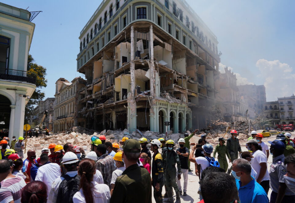 Firefighters and rescue workers work on the site after an explosion hit the Hotel Saratoga, in Havana, Cuba May 6, 2022. REUTERS/Alexandre Meneghini