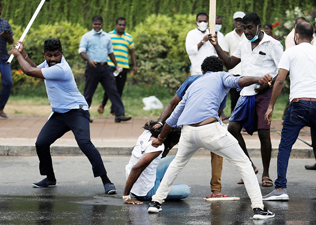 sri lanka's ruling party supporters storm anti government protest camp, in colombo