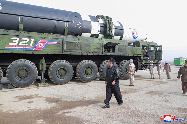 file photo: north korean leader kim jong un walks next to what state media reports is the "hwasong 17" intercontinental ballistic missile (icbm) on its launch vehicle