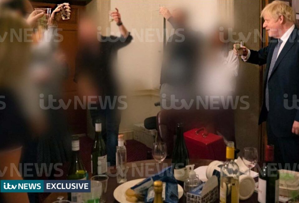 a handout picture shows british prime minister boris johnson raising a glass during a party at downing street, amid the coronavirus disease (covid 19) pandemic in london