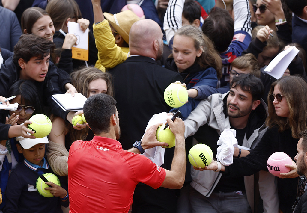 cover Impressive Djokovic canters into French Open last eight, Nadal clash looms