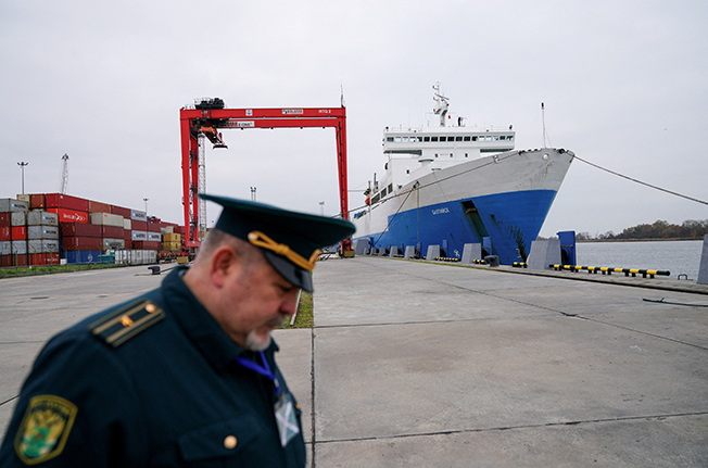 file photo: a russian customs officer works at a commercial port in baltiysk
