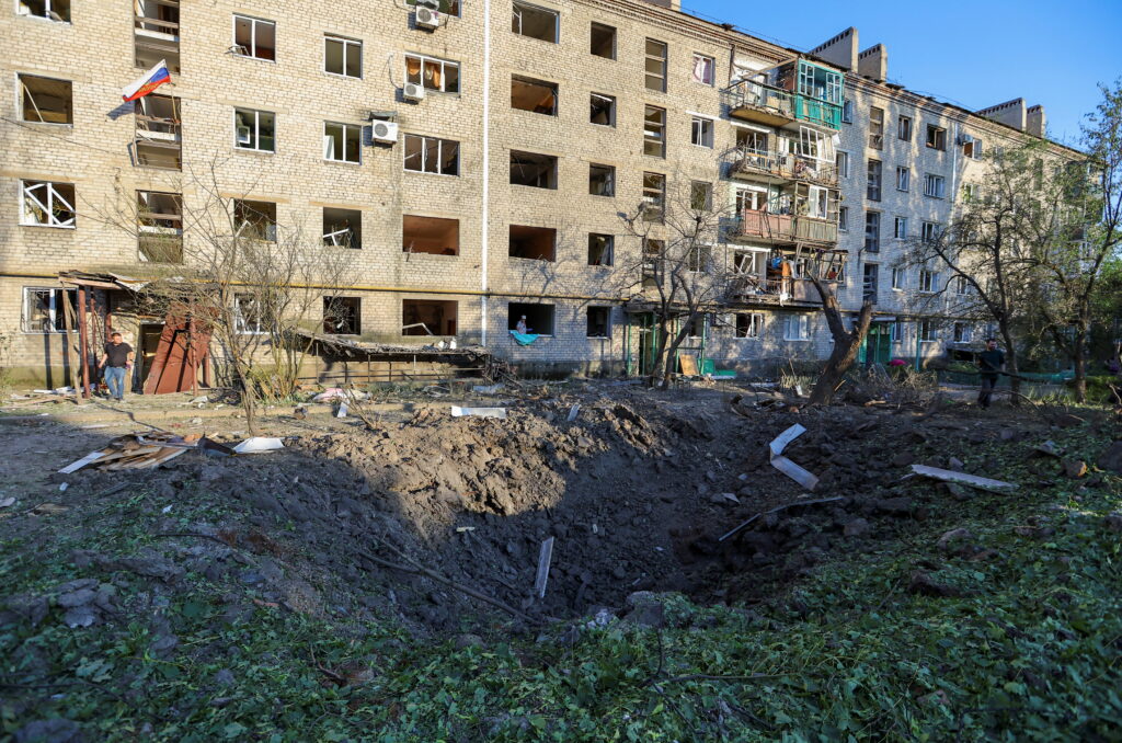 a view shows a damaged residential building in donetsk