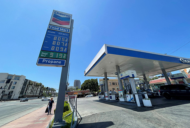 file photo: gas prices over the $8.00 mark are advertised at a chevron station in los angeles