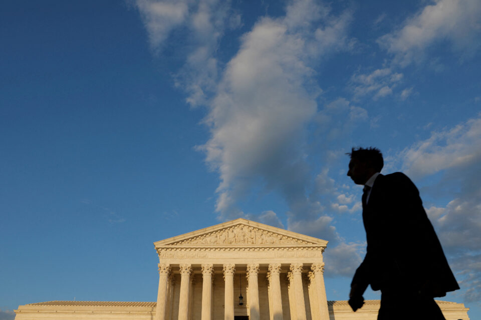 a person walks past the united states supreme court building in washington, d.c.