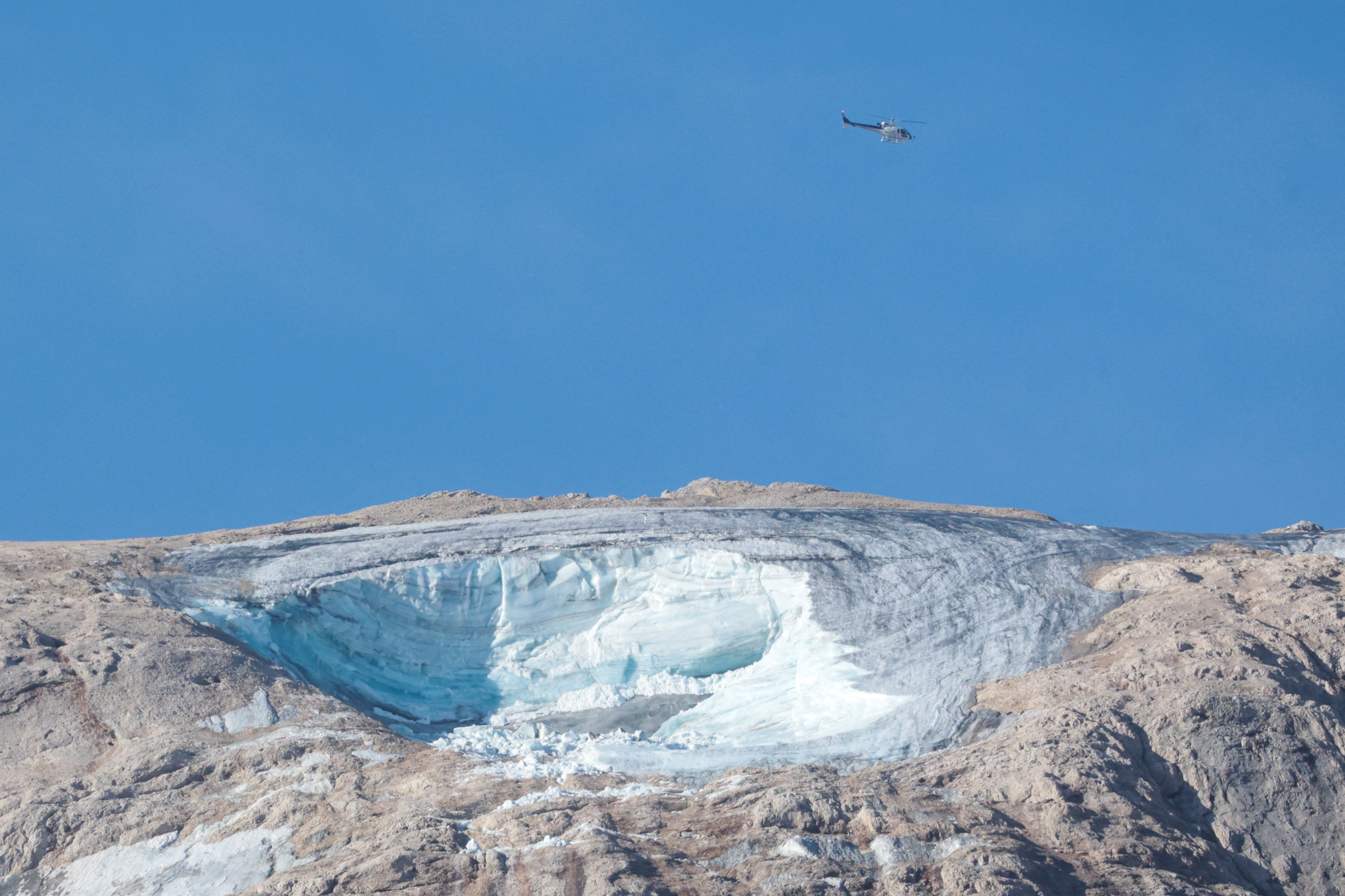 image Rescue teams scan mountains for missing after Italian glacier collapse