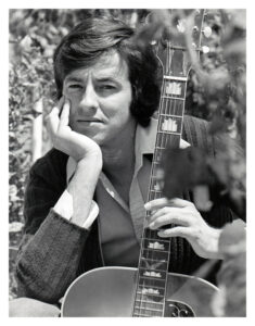 1977 playing guitar