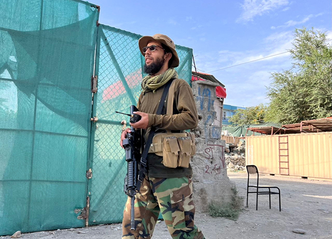 a taliban fighter stands guard near the site where al qaeda leader ayman al zawahiri was killed in a u.s. strike over the weekend, in kabul