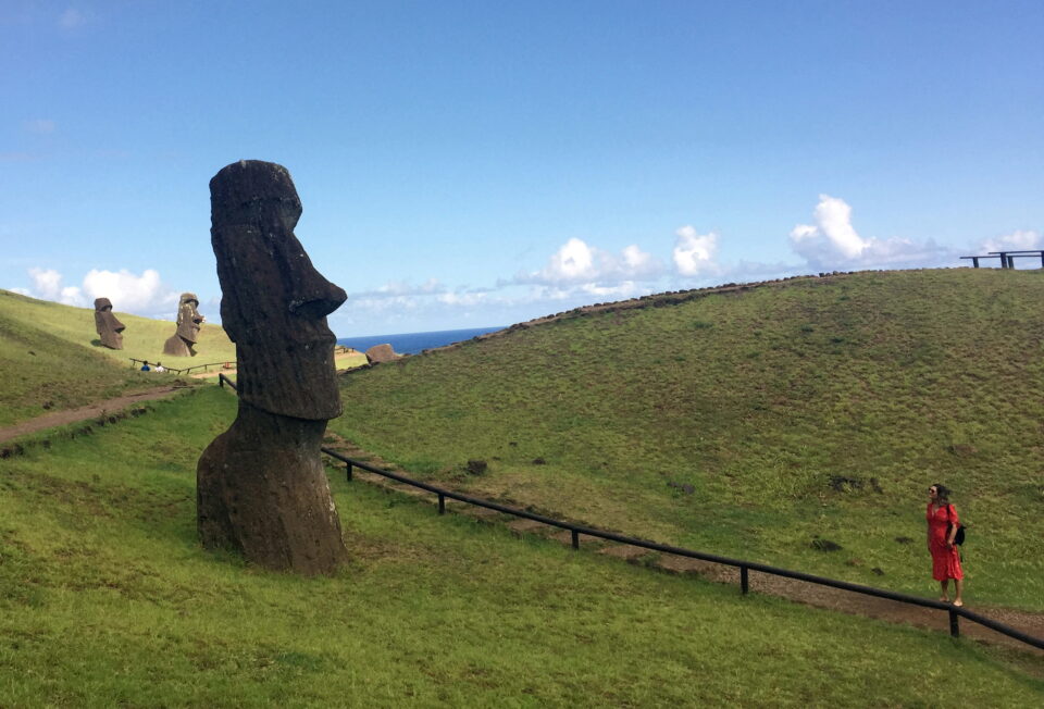 file photo: a tourist looks at a statue named "moai" at easter island