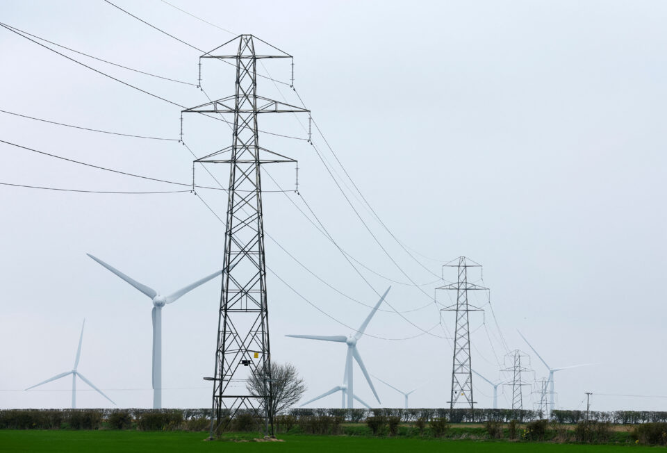 file photo: wind turbines and electricity pylons are seen in finedon