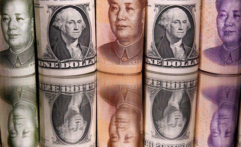 image Dollar resumes rally, yuan weakens past key level