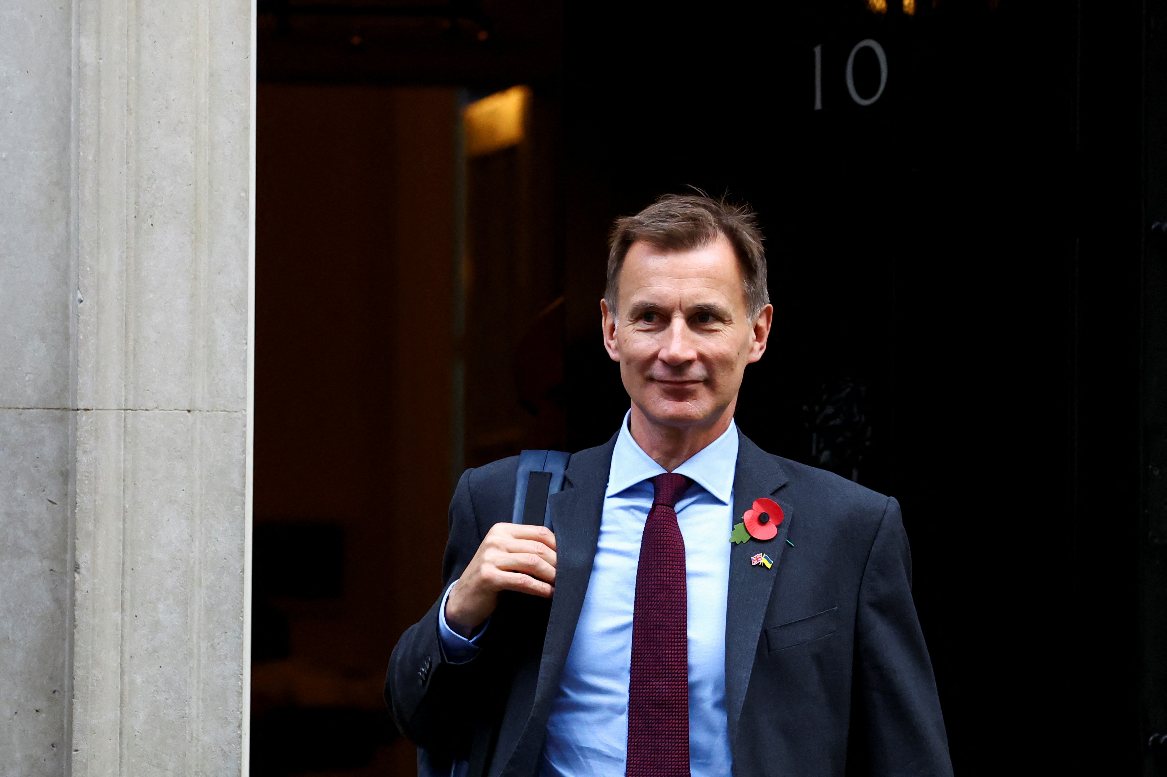 image UK must raise taxes and cut spending, Hunt says ahead of budget