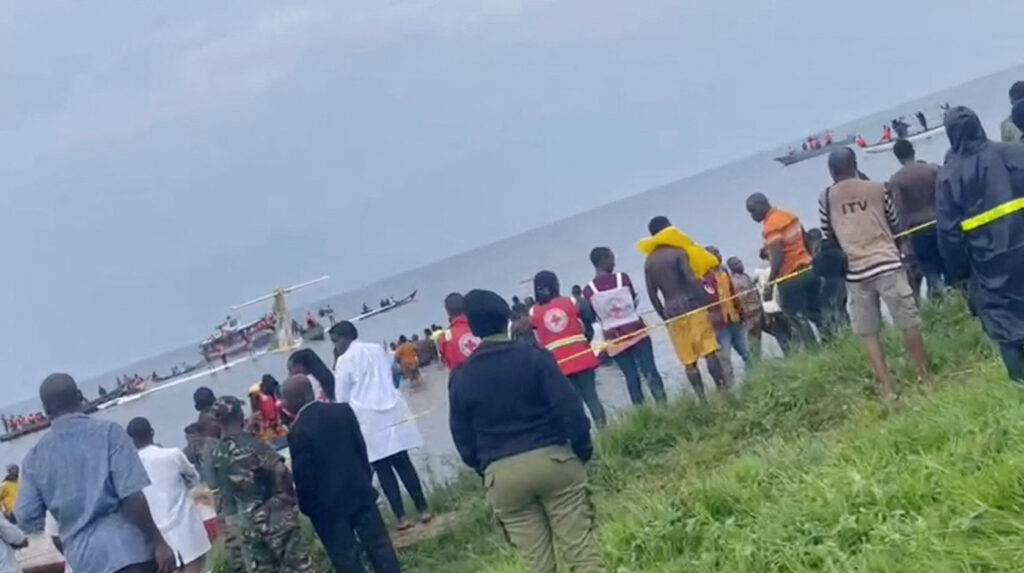 people look at precision air plane that crushed into lake victoria