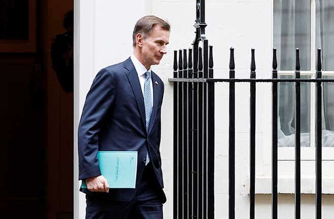 image UK&#8217;s Hunt hikes taxes, tightens grip on spending in tough budget