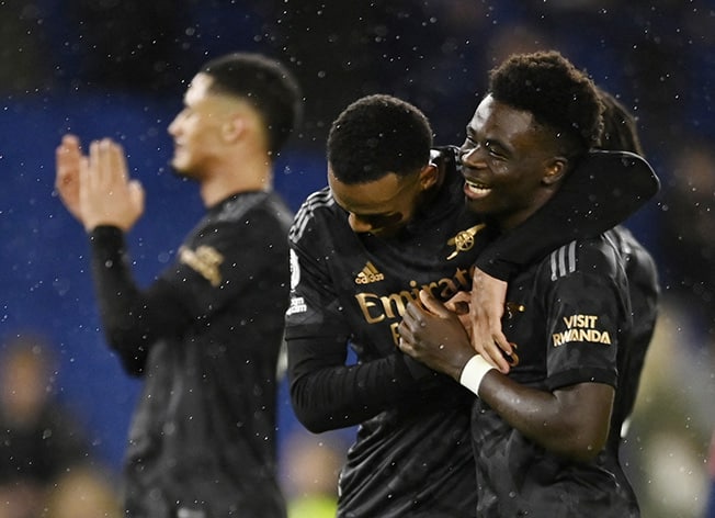 image Arsenal go seven points clear with 4-2 win over Brighton