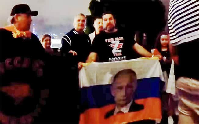 image Djokovic&#8217;s father seen posing with fans carrying Russia flags