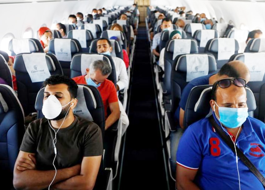 WHO urges travellers to wear masks as new COVID variant spreads