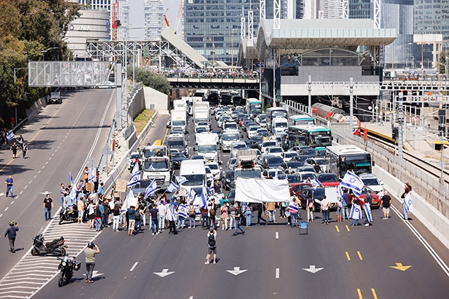 image Stun grenades, arrests on &#8216;day of disruption&#8217; protest in Israel