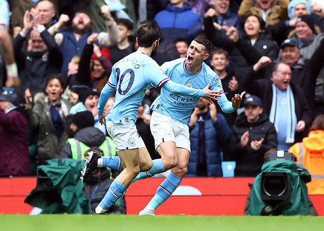 cover Man City beat Newcastle 2-0 to maintain pressure on Arsenal