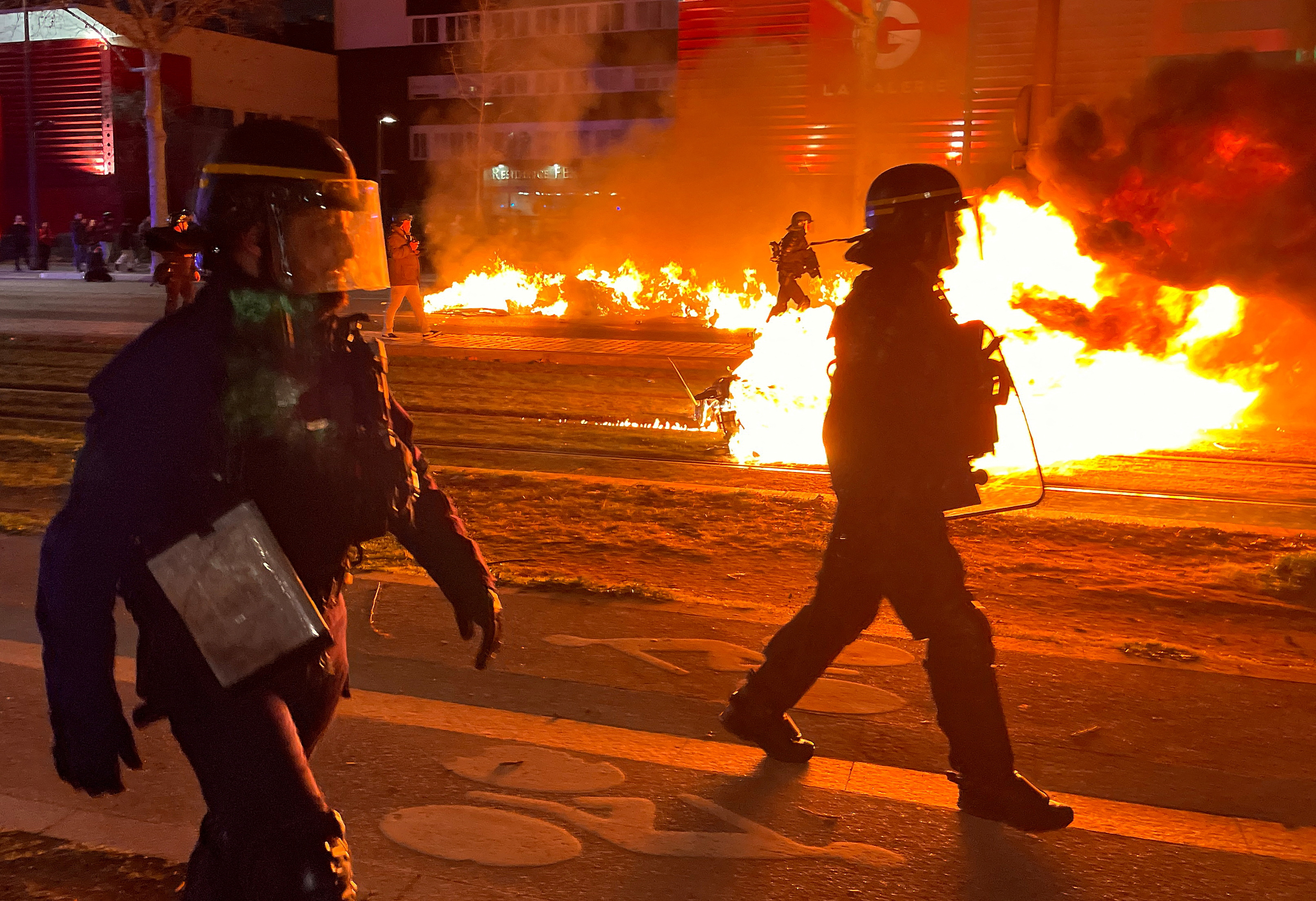 image Paris police, protesters clash for third night over Macron&#8217;s pension reform
