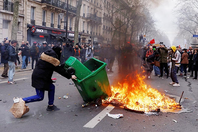 image Macron signs contested pension bill into law, protesters vow to fight on (Updated)