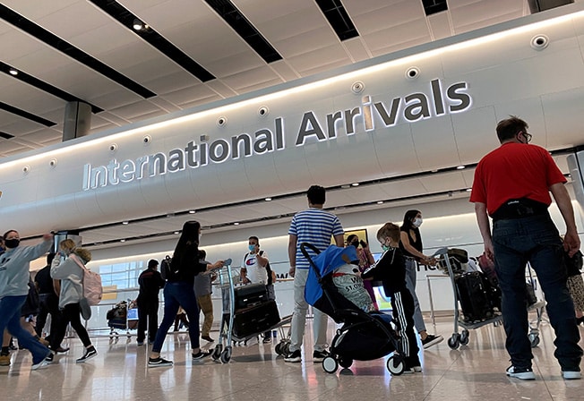 file photo: passengers from international flights arrive at heathrow airport, following the outbreak of the coronavirus disease (covid 19), london, britain