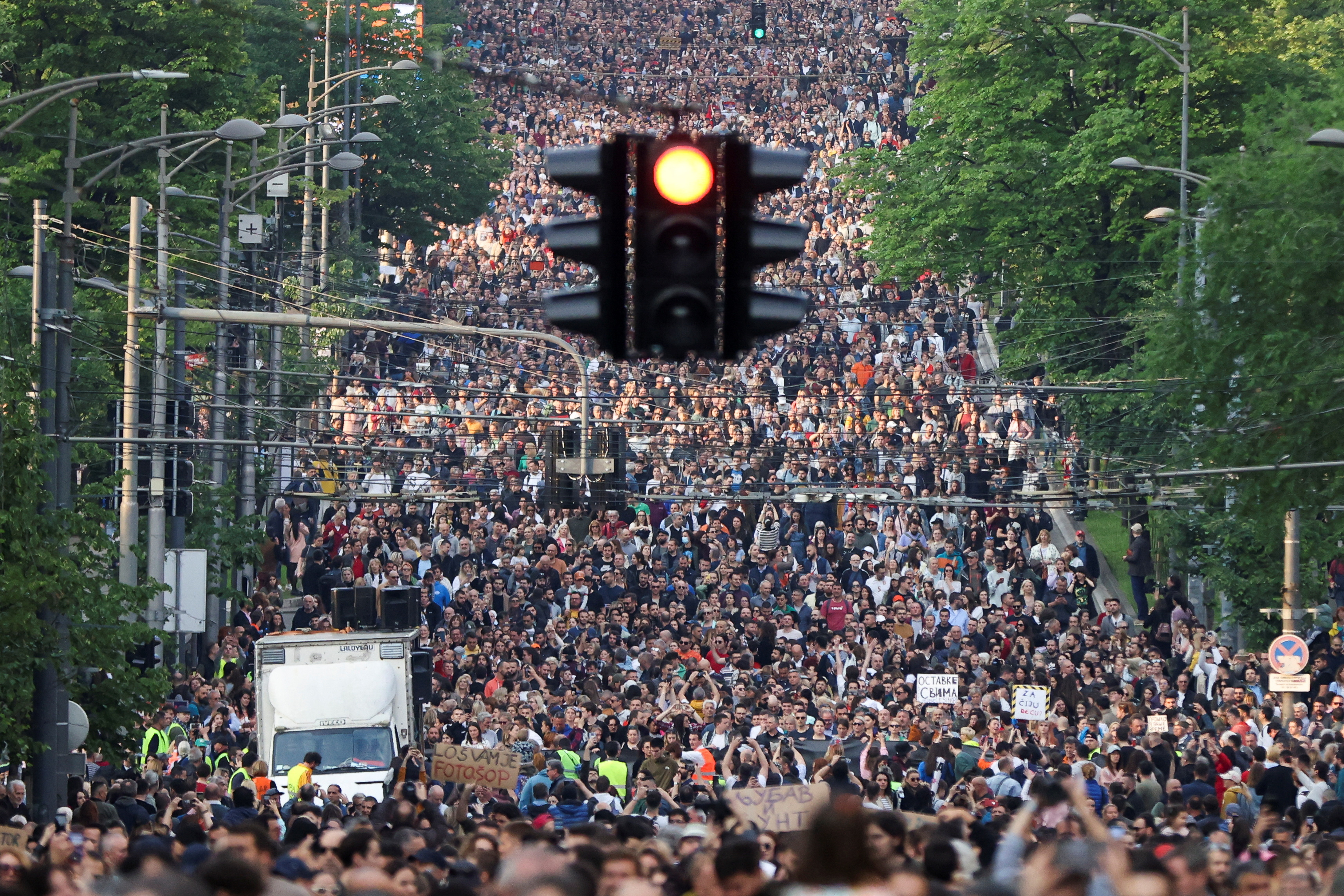 image Tens of thousands gather in Belgrade protest over mass shootings