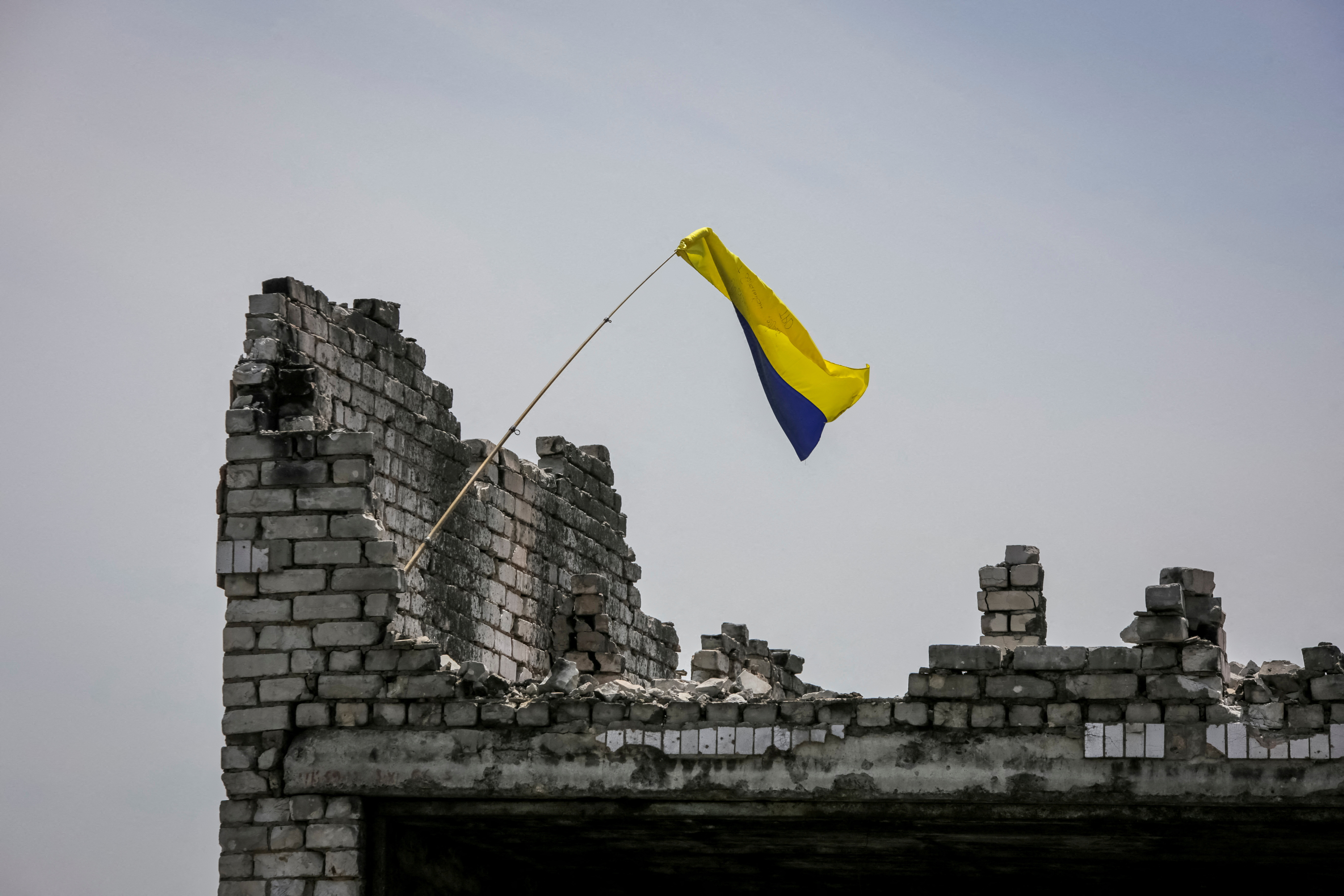 cover Blue and yellow flag, Russian dead attest to Ukrainian advance in south