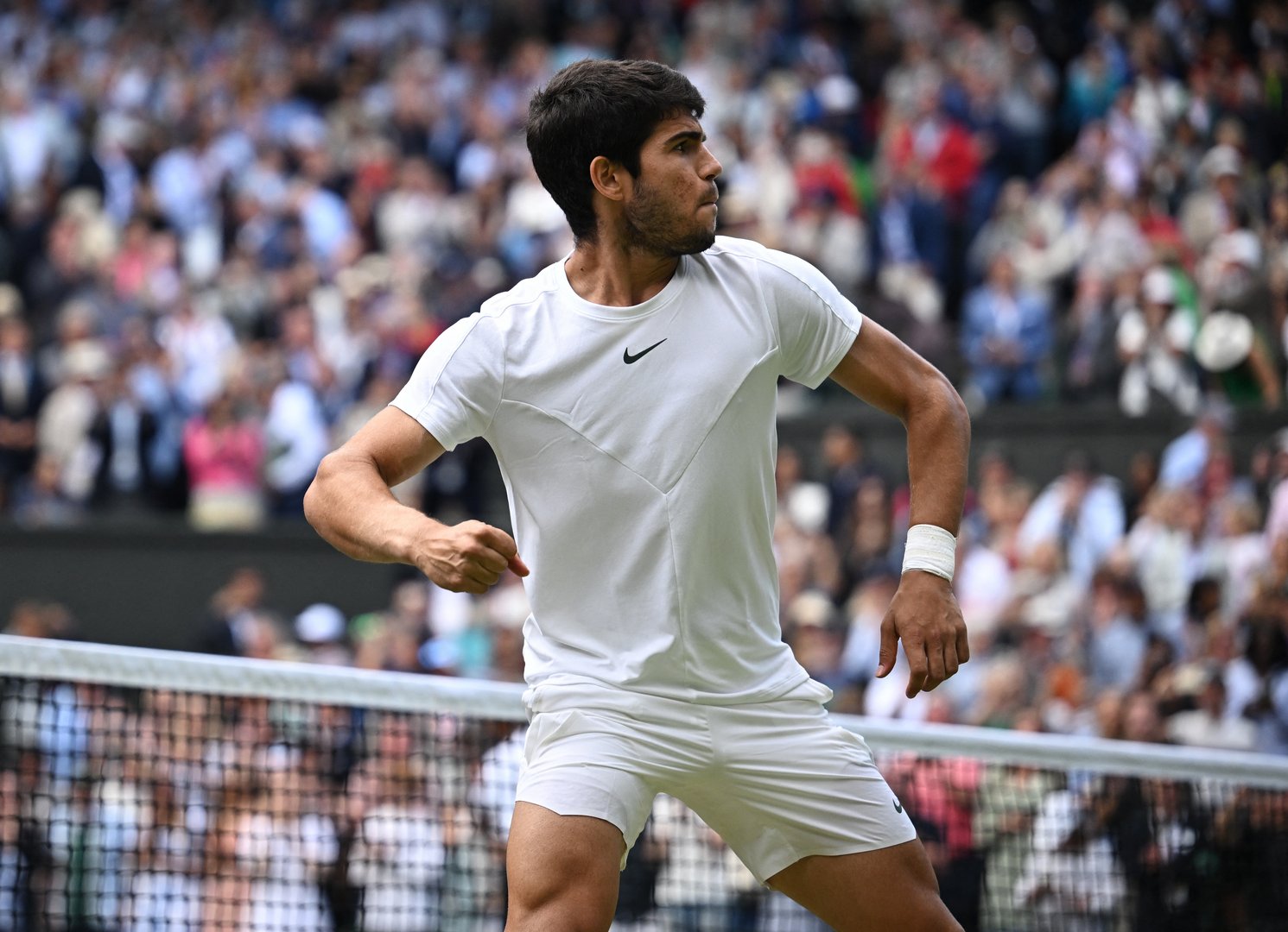 image Alcaraz douses Rune fireworks to reach Wimbledon semis for first time