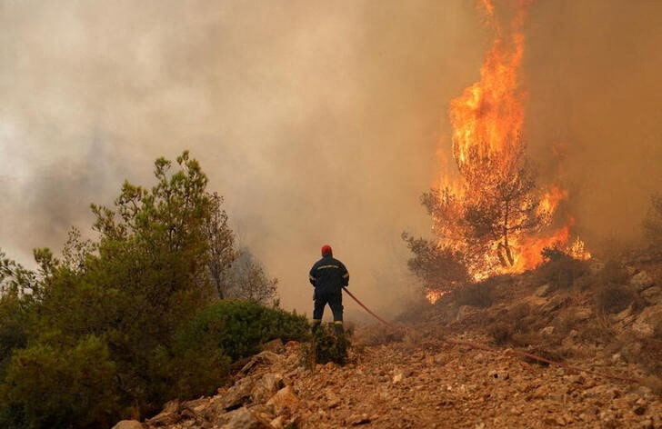 image Cypriot aid teams dealing with flare ups in Greece, as fires rage
