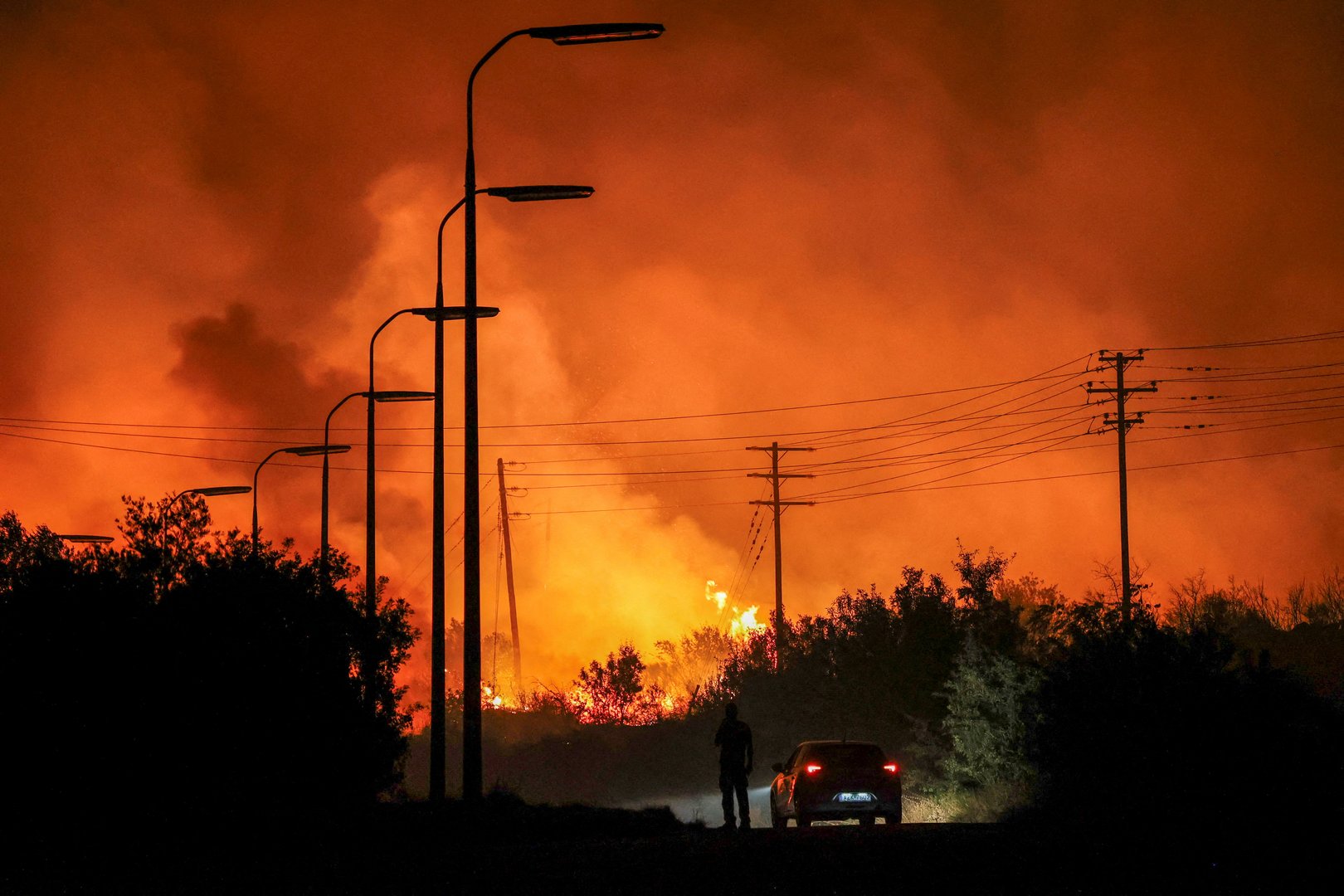 image Firefighters battle Greece wildfires overnight as farms, factories burn