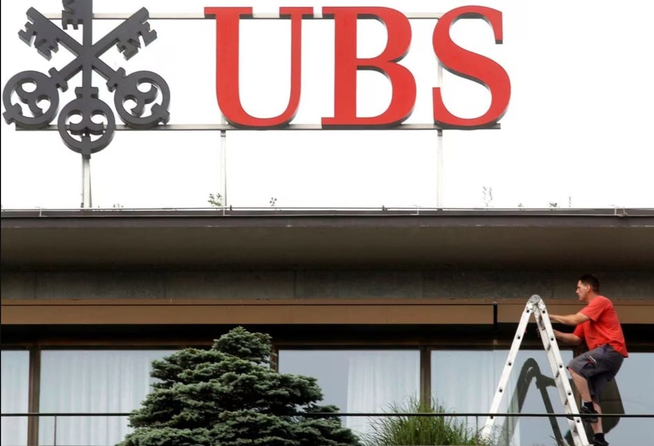 cover UBS investors warm to Credit Suisse deal