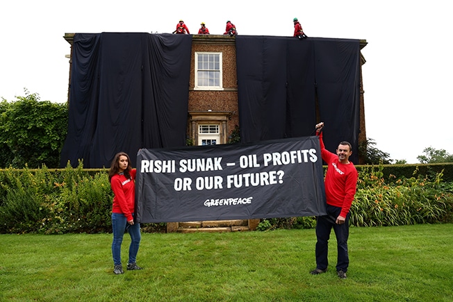 image Protesters drape home of UK&#8217;s Sunak in black fabric over oil policy
