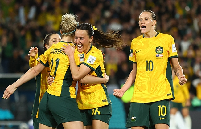 image Australia down Danes to reach quarter-finals