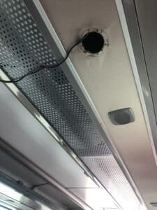 feature andria exposed cable coming the ceiling of an intercity bus